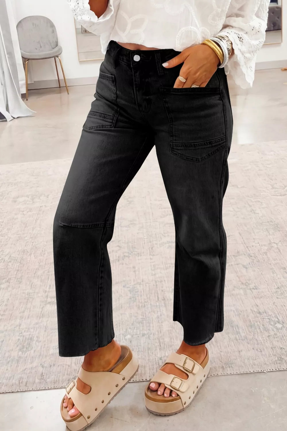 Frayed cropped straight leg jeans in black front view
