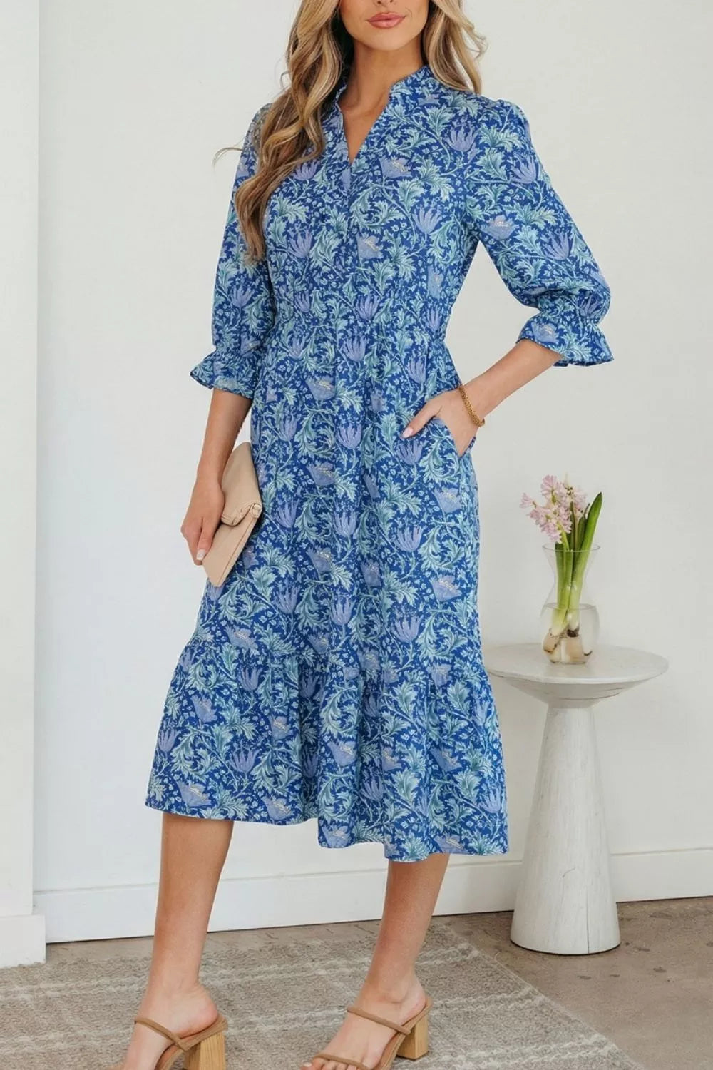 Dusty blue floral V neck tiered maxi dress back view