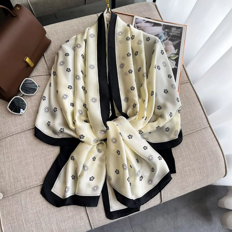 Contrast trim scarf draped softly over the shoulders