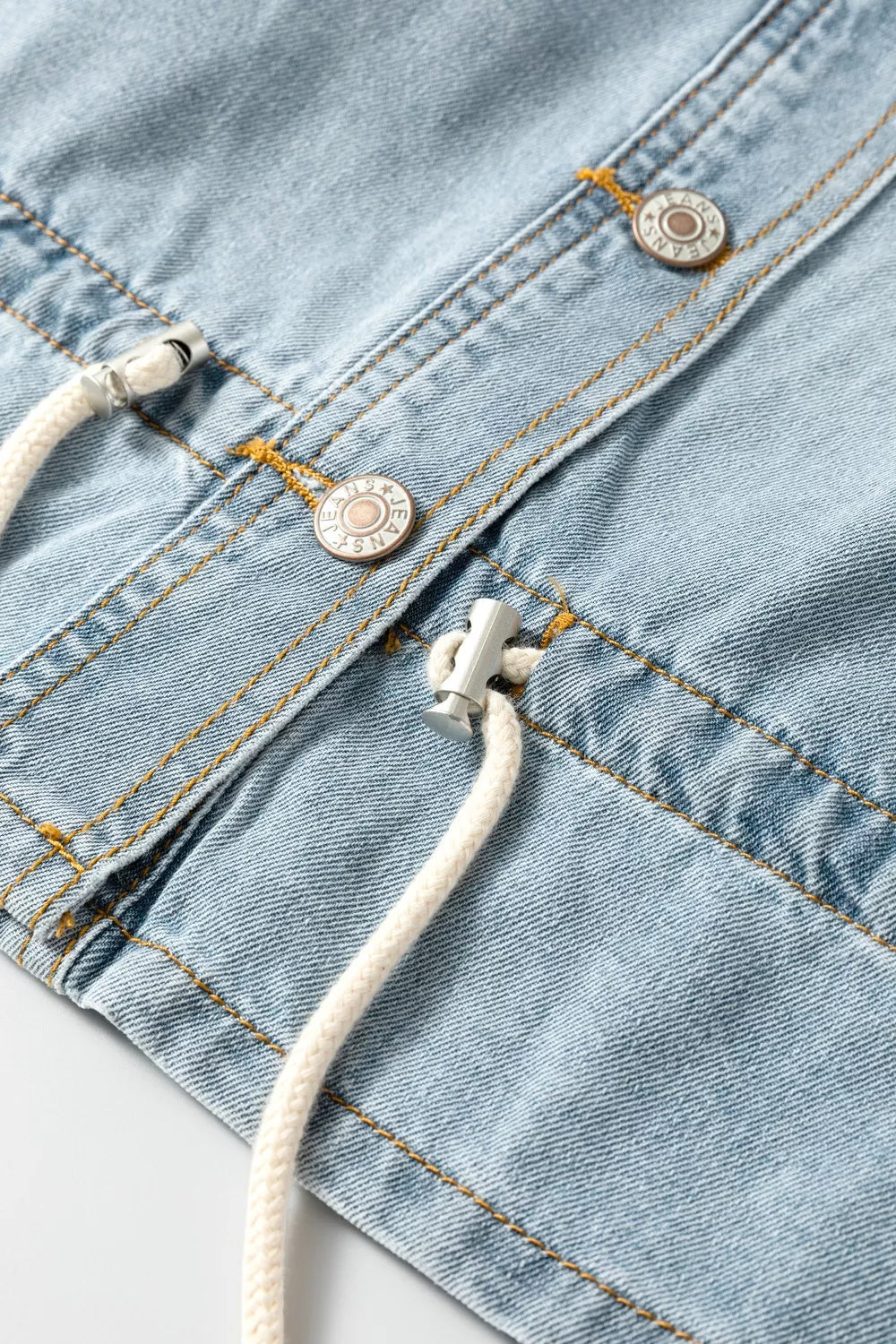 Light wash denim jacket styled as a casual spring layer