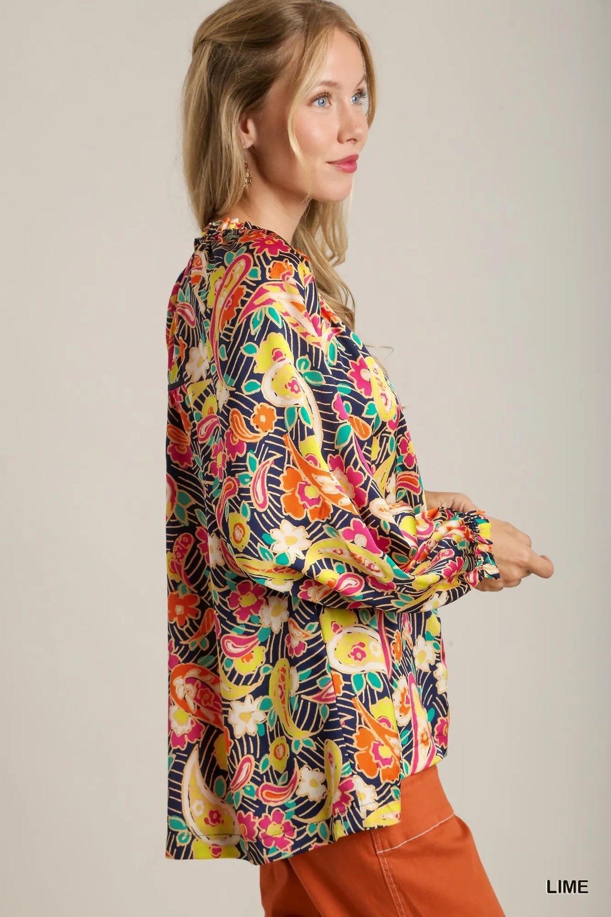 Ruffle neckline close up on satin blouse