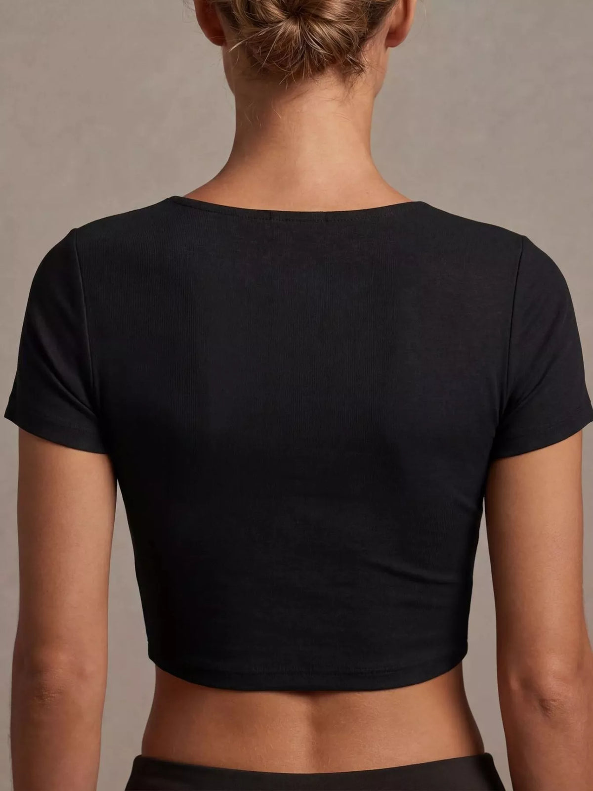 Black twist front cropped top, close up fabric detail