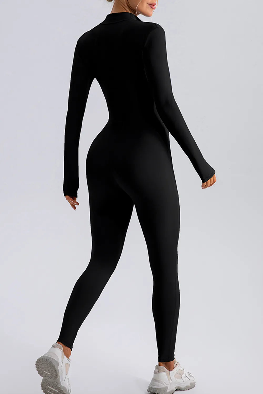 Half zip mock neck active jumpsuit standing view