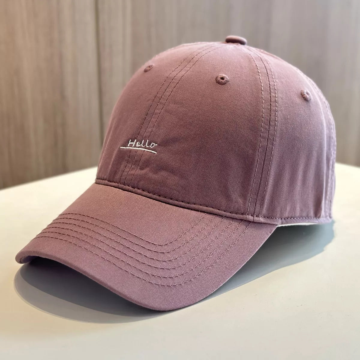 Embroidered cap shown in an alternate colourway