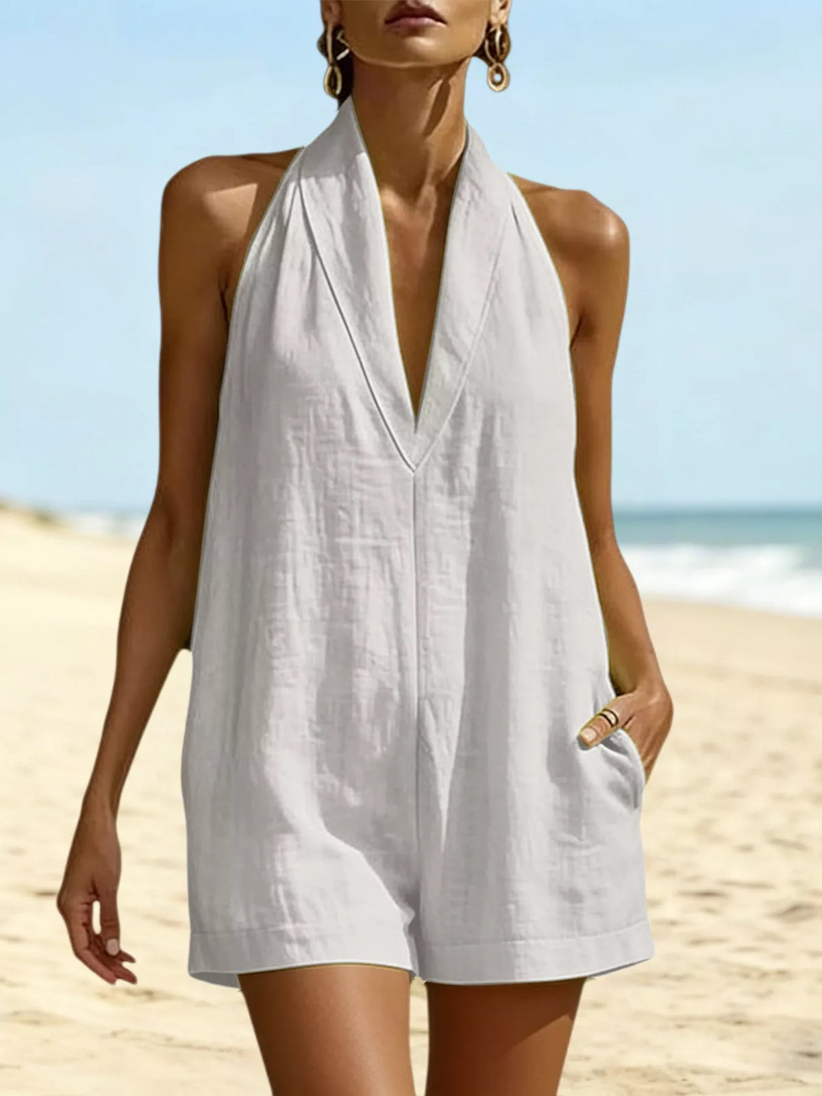 Halter neck romper with pockets front view
