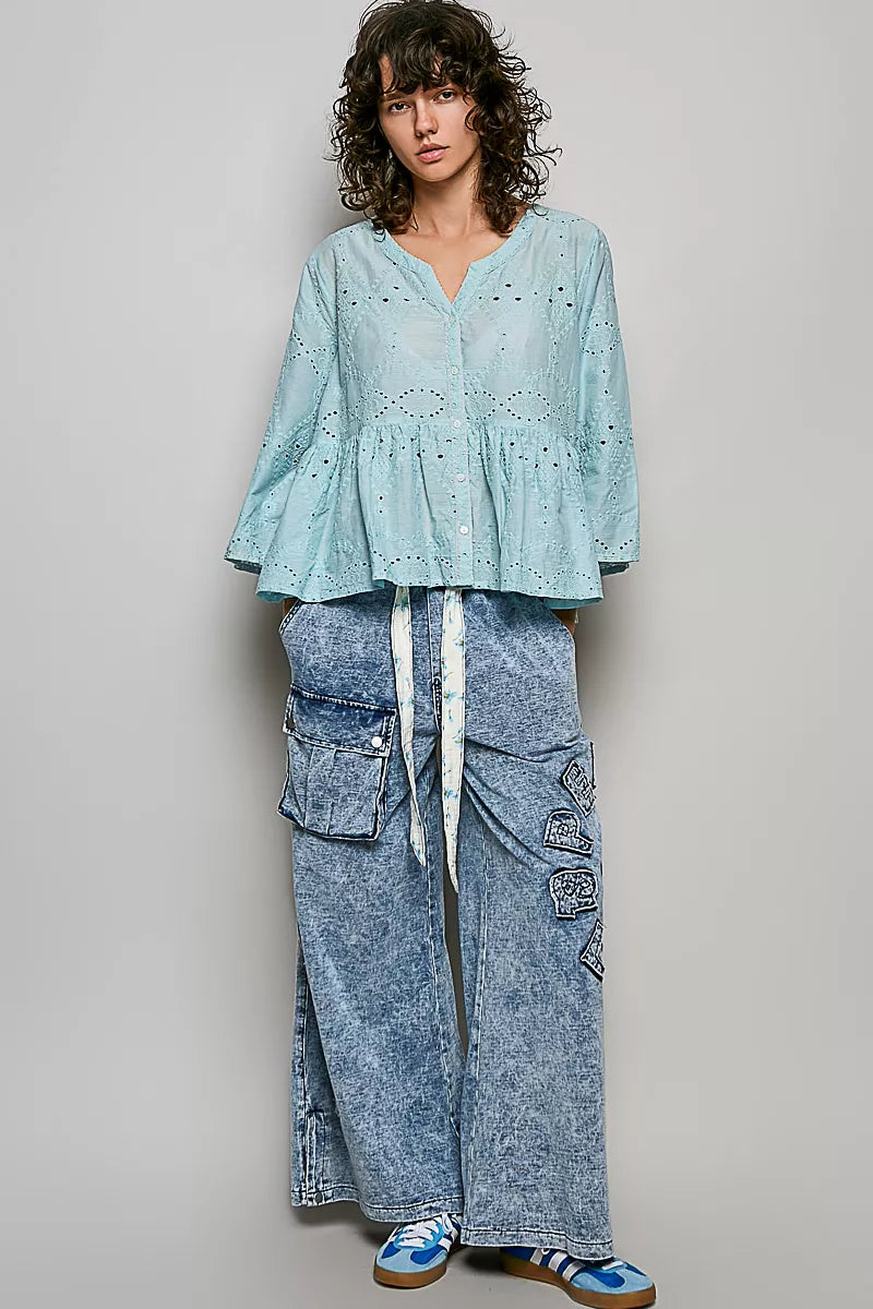 Side view showing the gathered waist and peplum hem