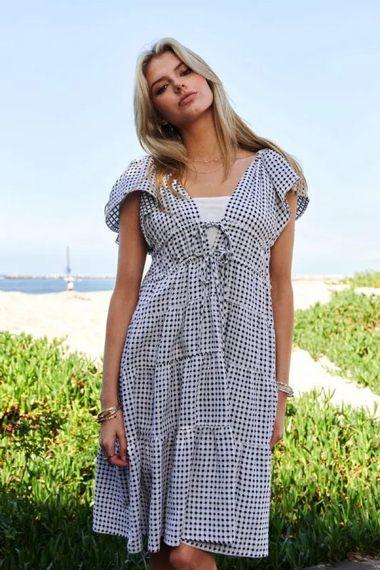 Jacquard V Neck Flutter Sleeve Tiered Dress in Black and Ivory back view