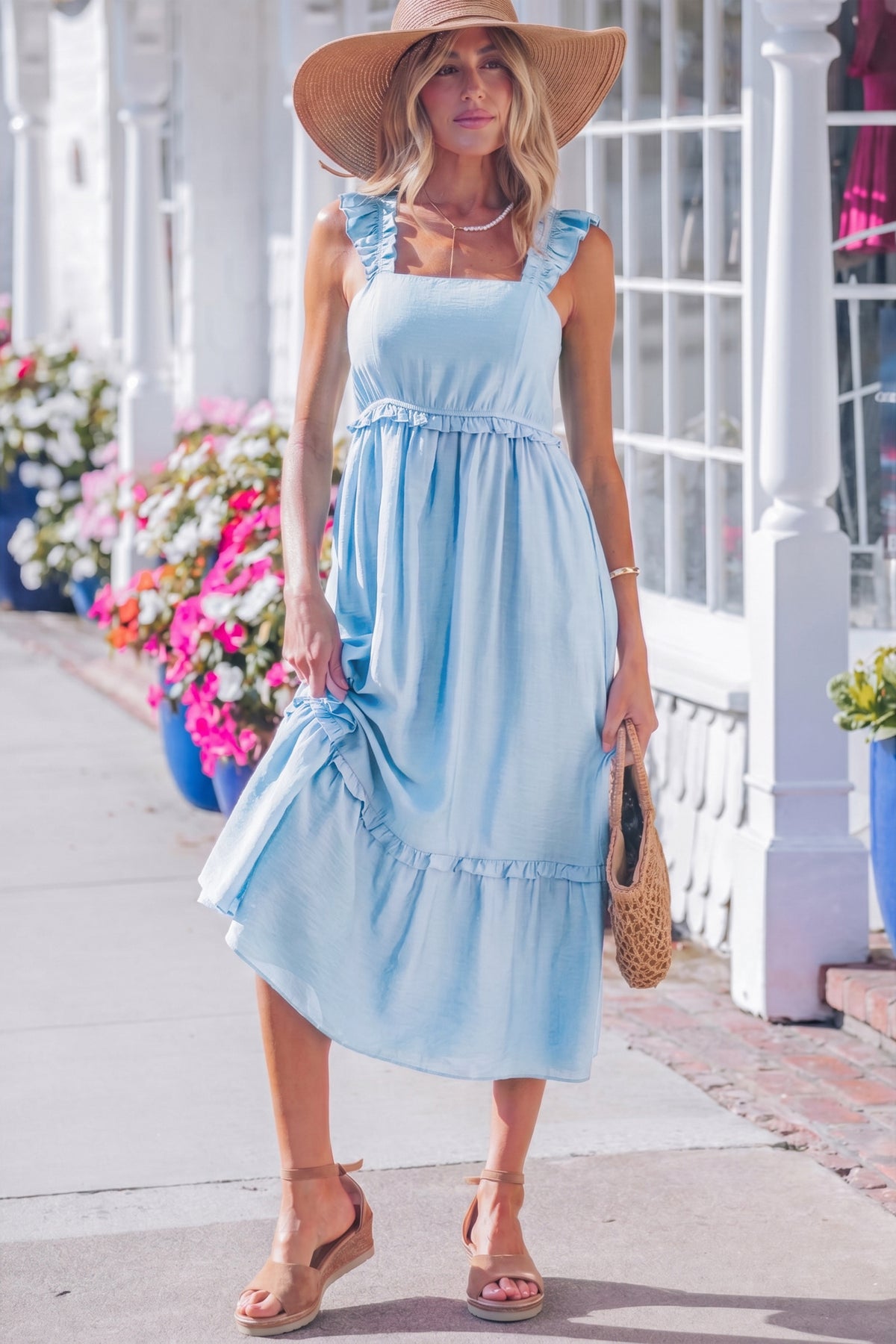 Sleeveless blue maxi dress flared hem