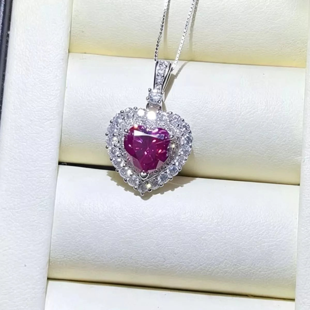 Pink moissanite necklace worn on the collarbone