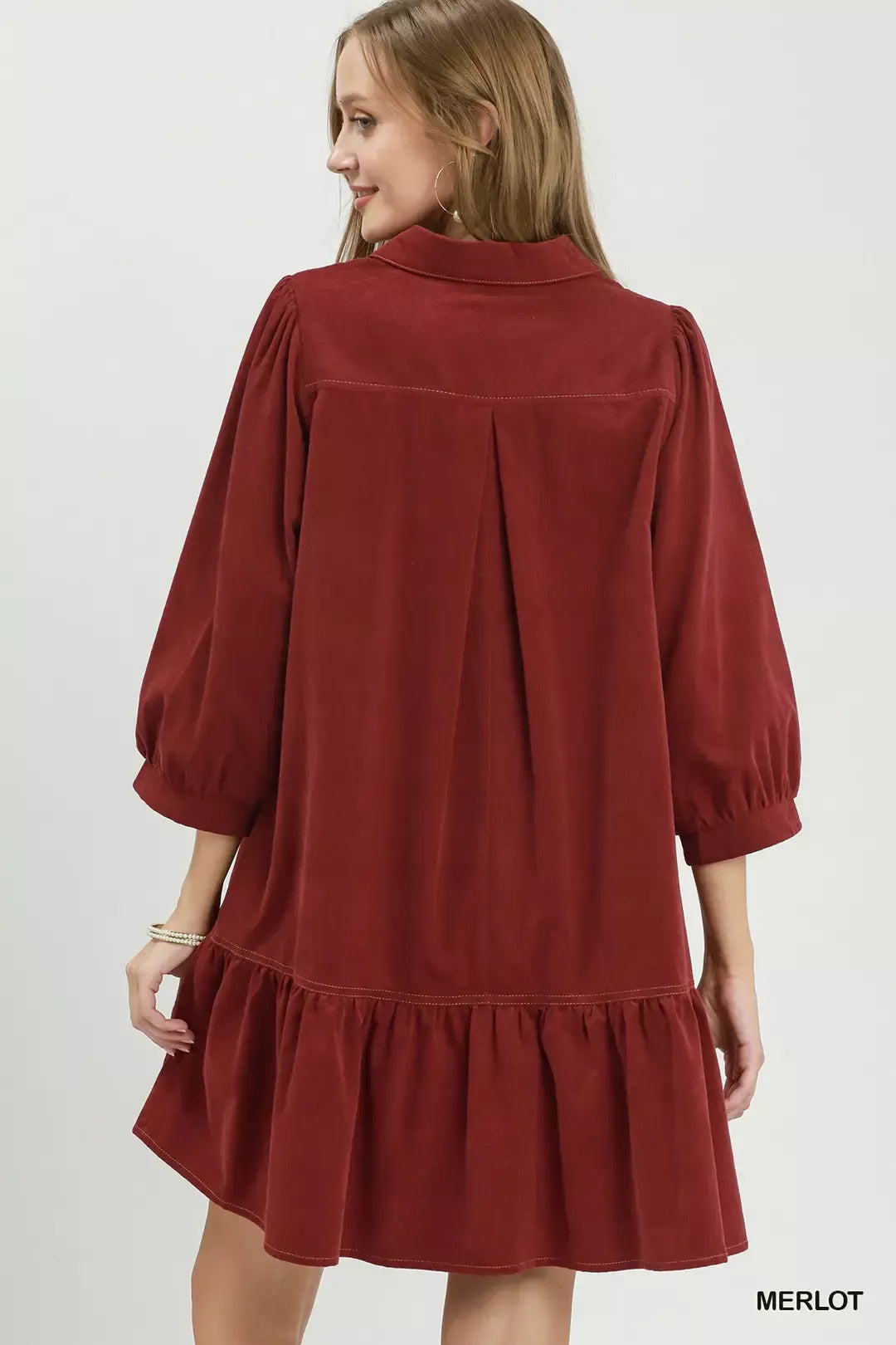 Contrast trim and exposed seam detail on corduroy dress