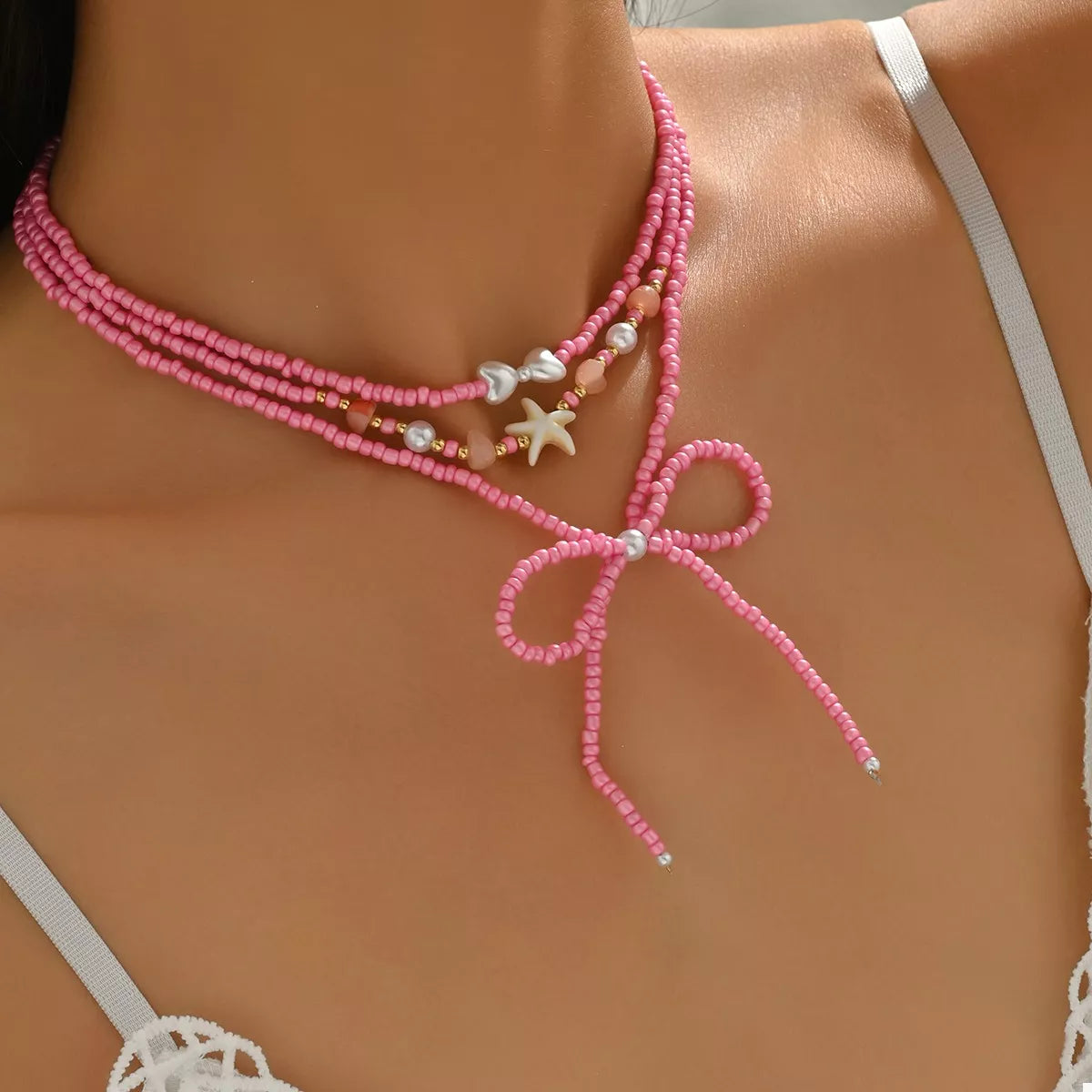 Fashorio Fuchsia Pink / onesize Beaded Three-Layered Necklace with Bow and Starfish Charms