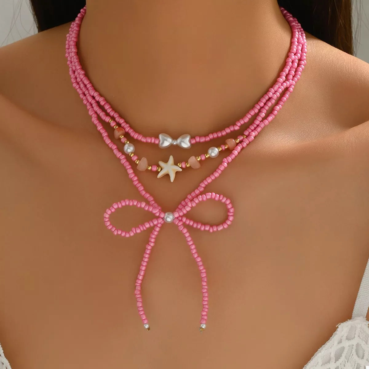 Fashorio Fuchsia Pink / onesize Beaded Three-Layered Necklace with Bow and Starfish Charms