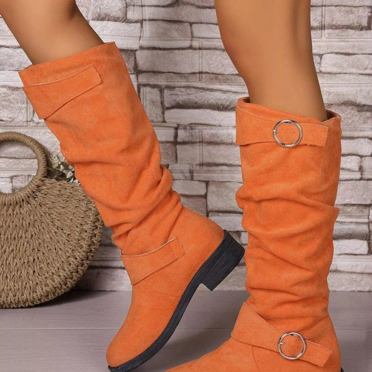 Suede slouch boots pair standing together