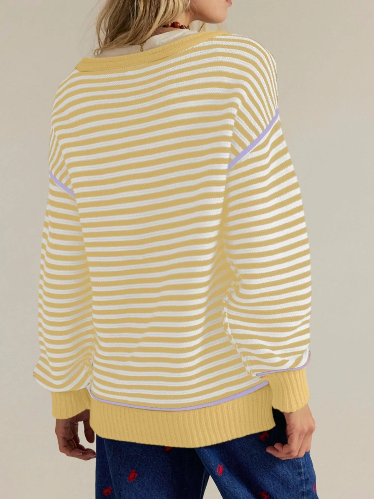 Striped sweater styled with jeans