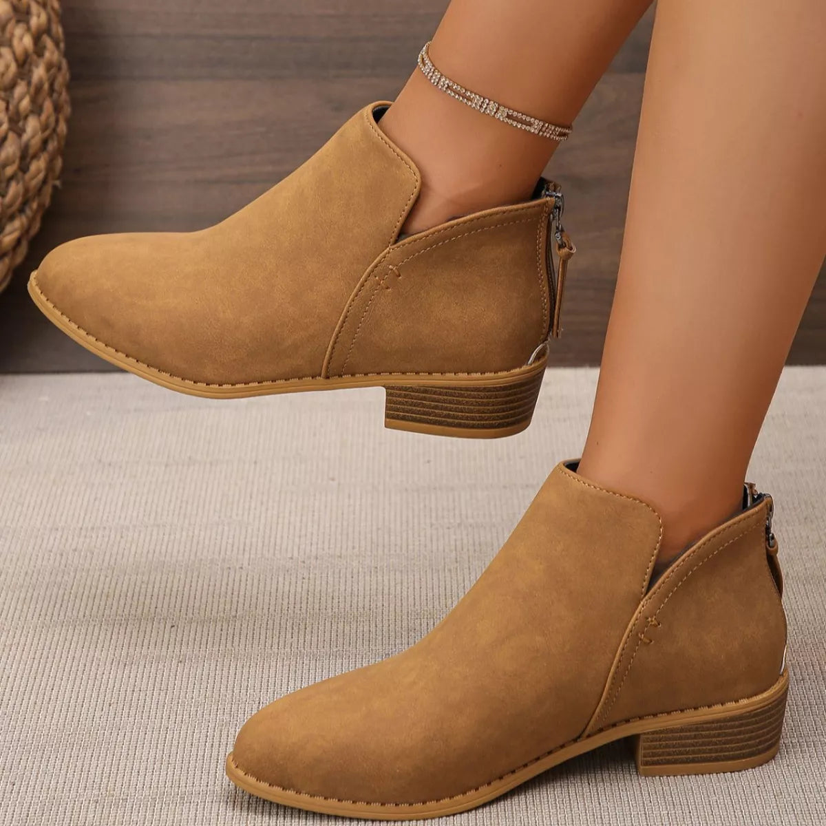 Point toe block heel ankle boots three quarter view
