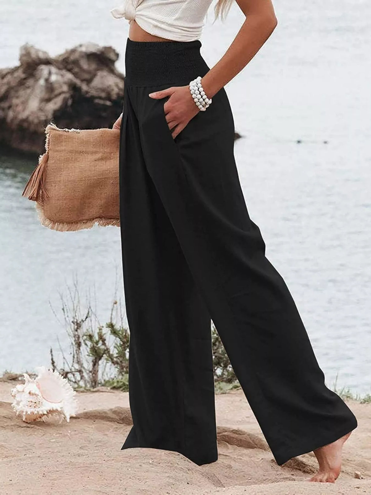 Smocked high waisted wide leg pants close up view