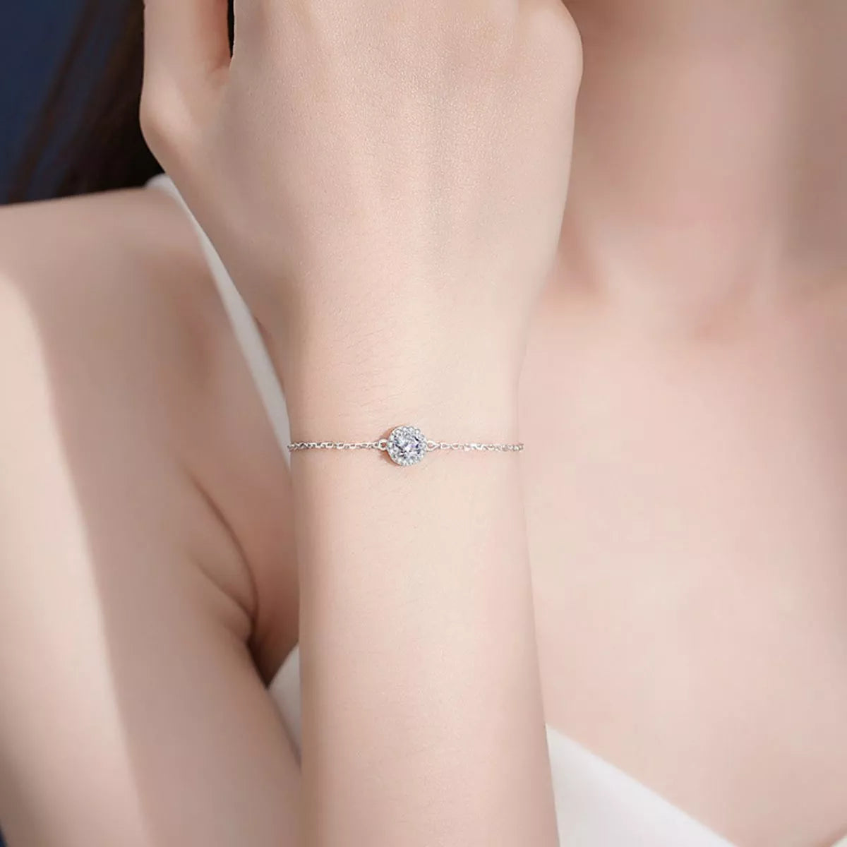 Sterling silver moissanite bracelet fastened on a model wrist