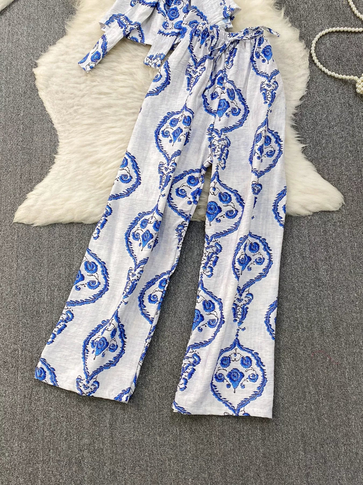 Two piece belted set neckline detail