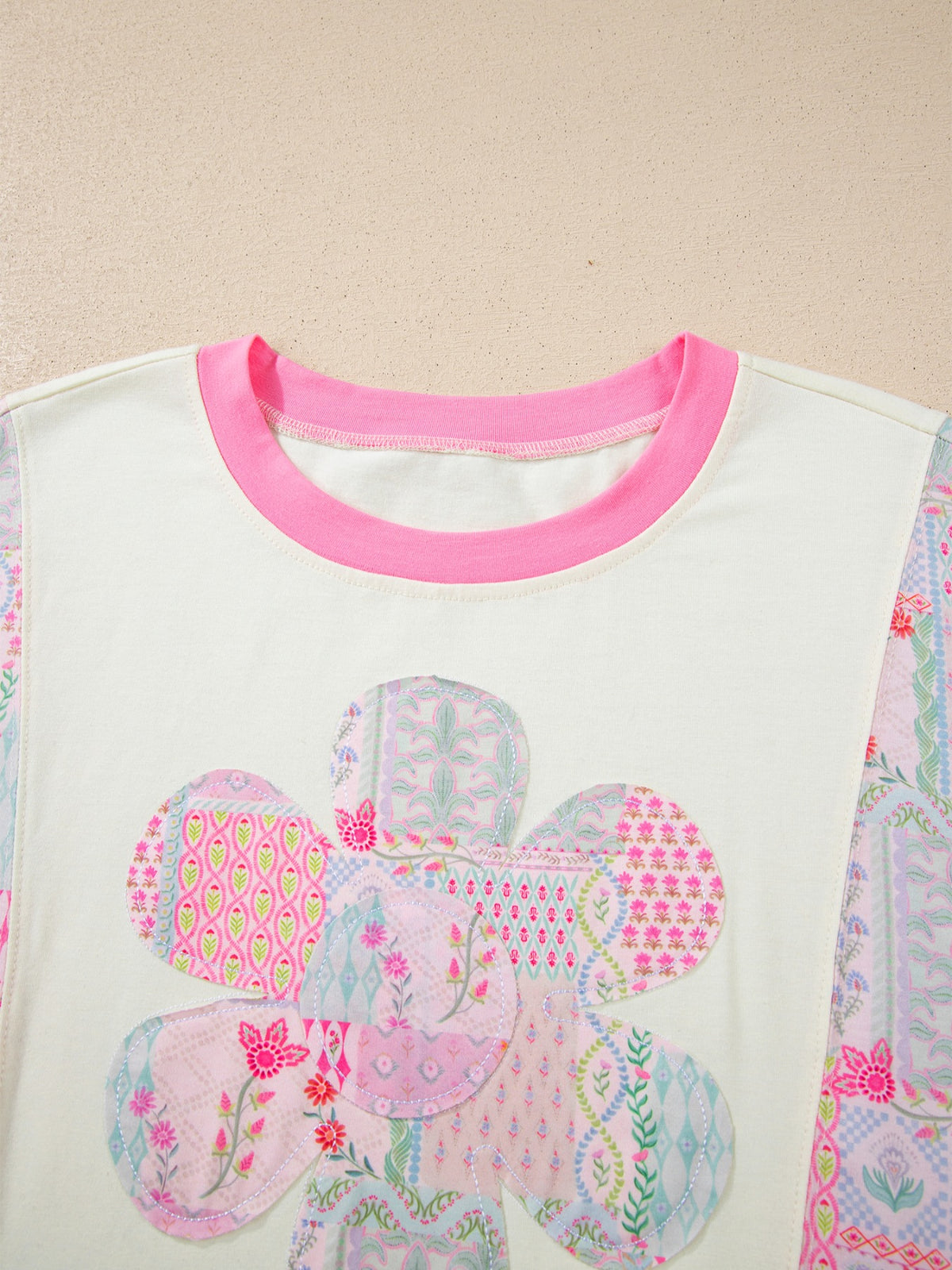 Neckline detail of the dusty pink relaxed top