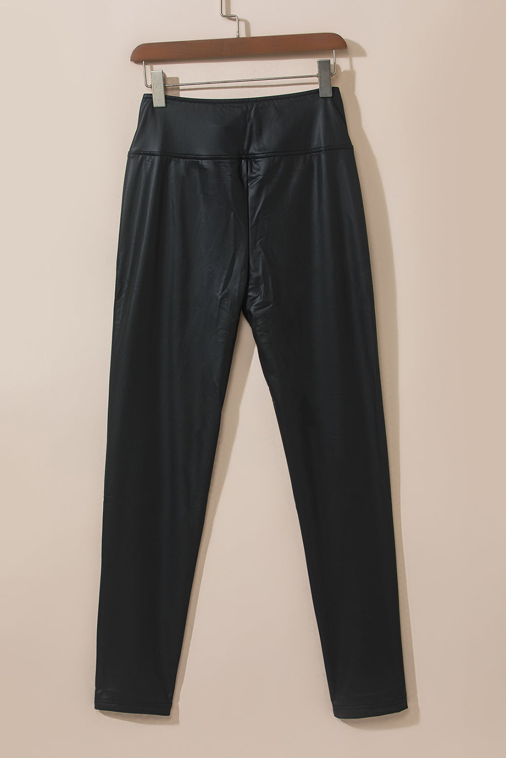 Black faux leather high waist leggings close up detail
