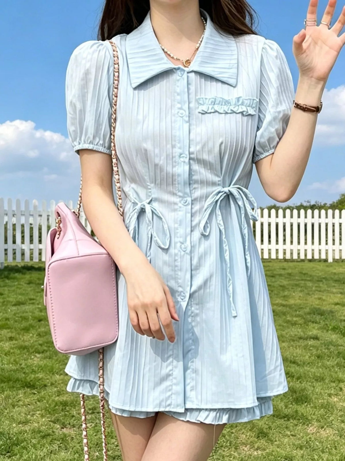Coordinated light blue shirt and shorts side view