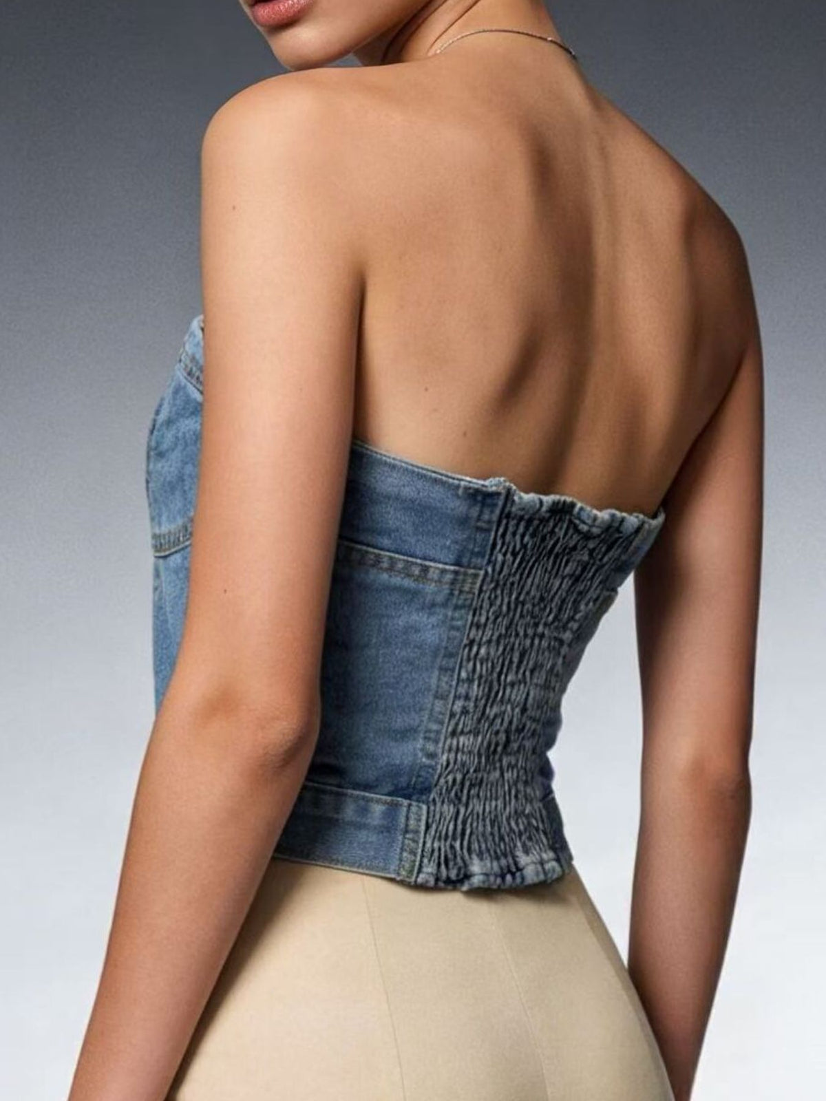 Detail of the hem on the cropped denim tube top