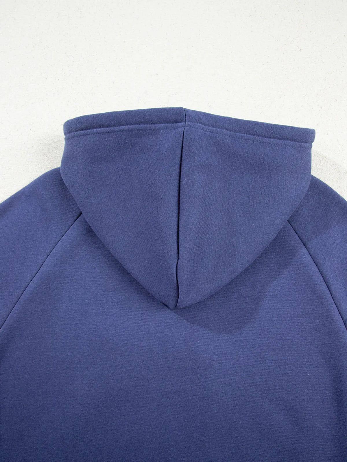 Back view of navy fleece hoodie
