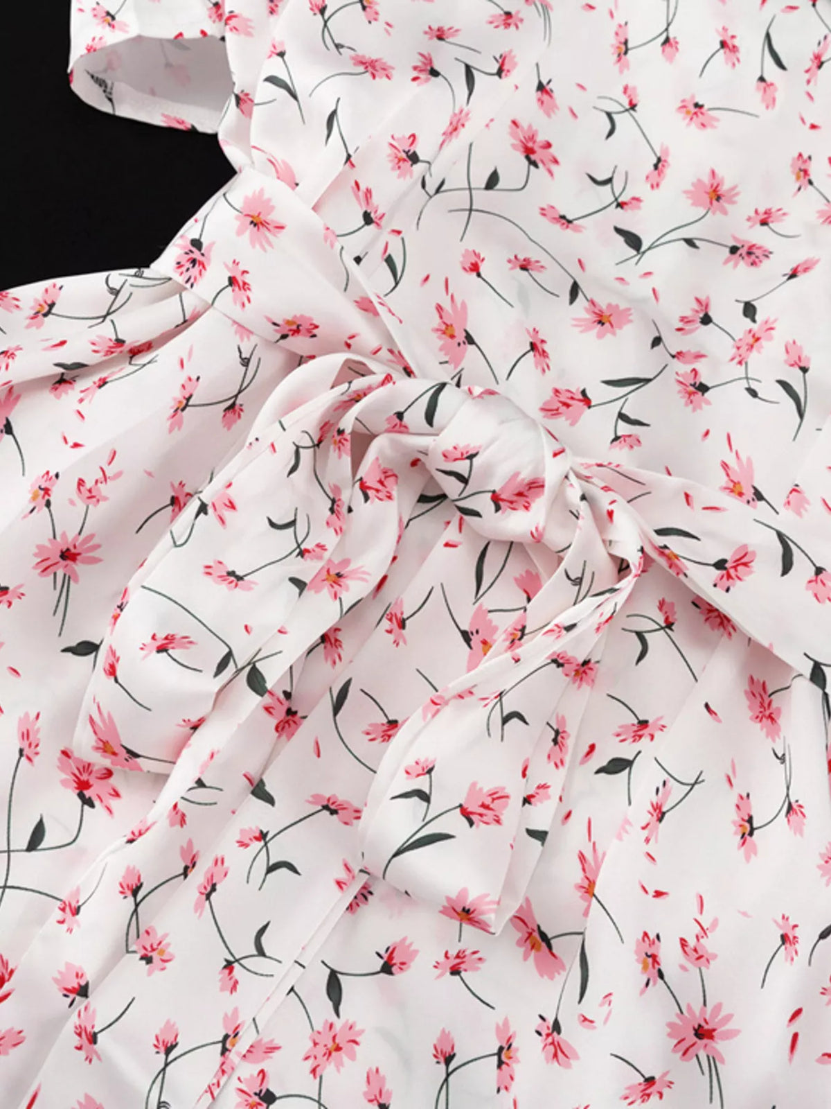 Hem detail on a dusty pink floral dress