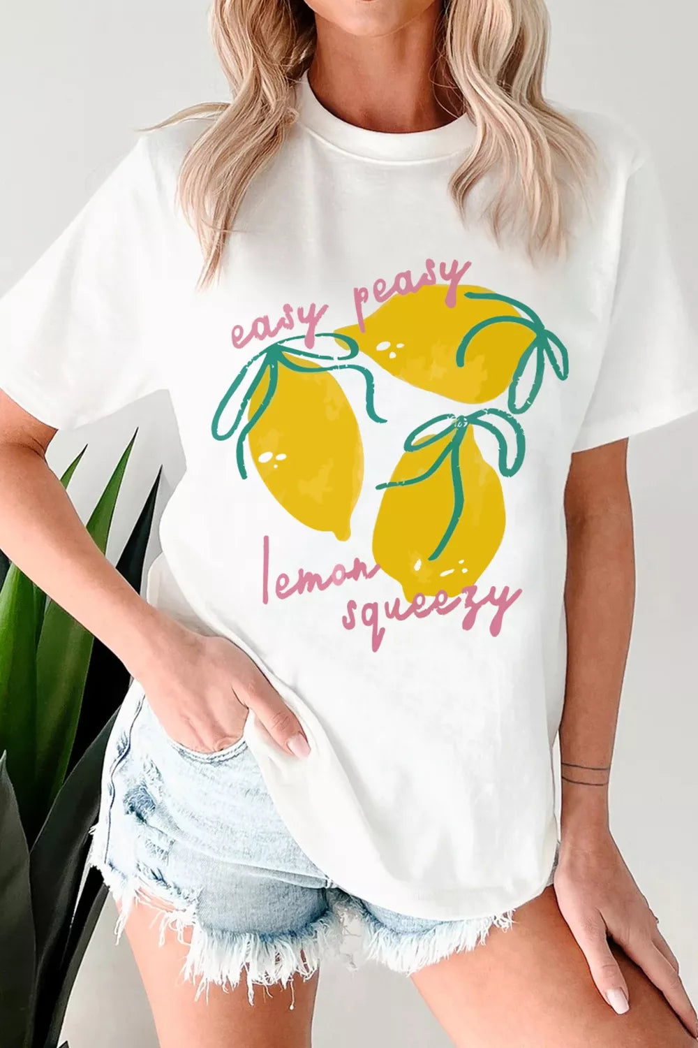 White Easy Peasy Lemon Squeezy graphic tee styled view