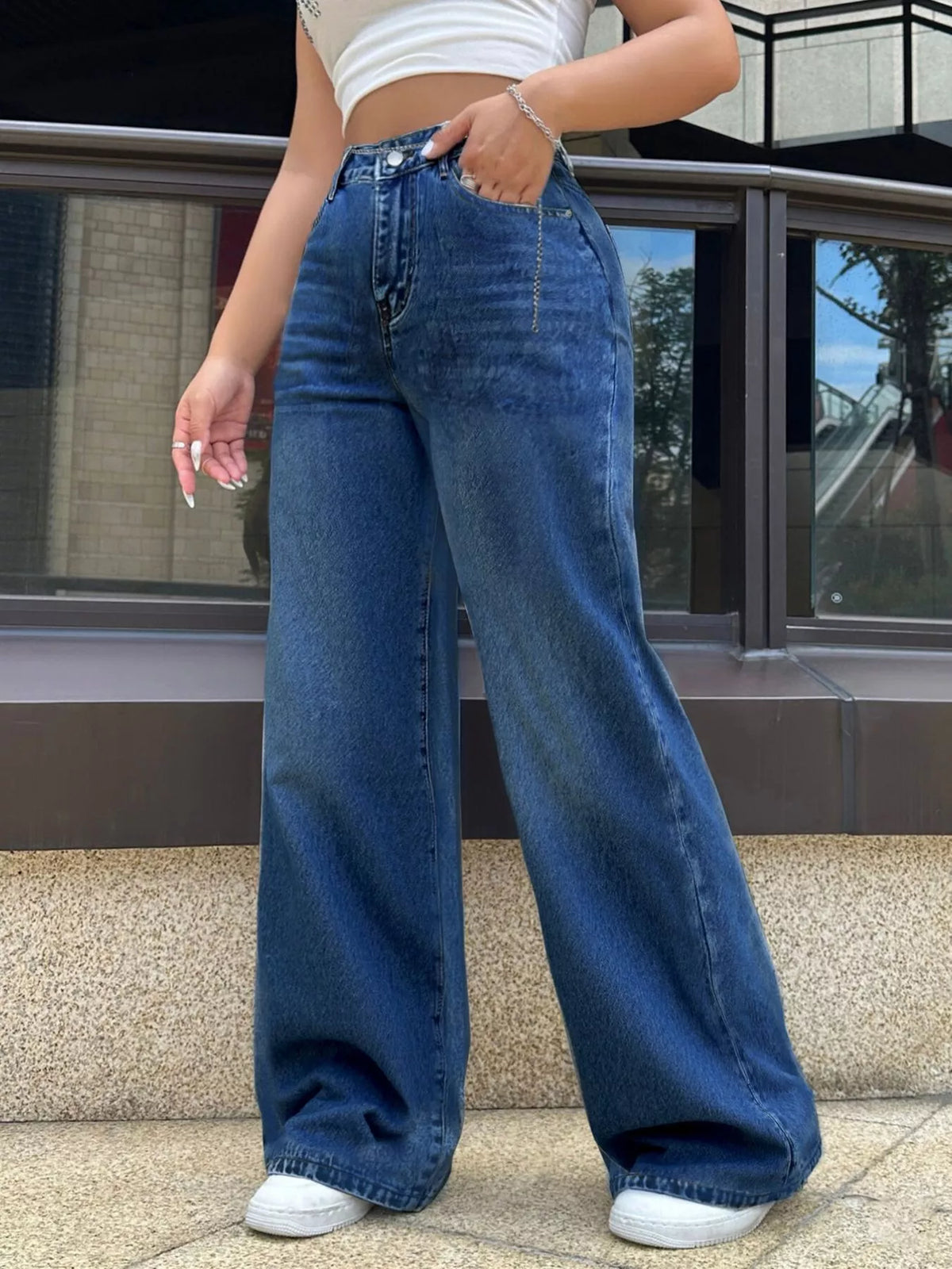 Dark wash wide leg jeans on model full length