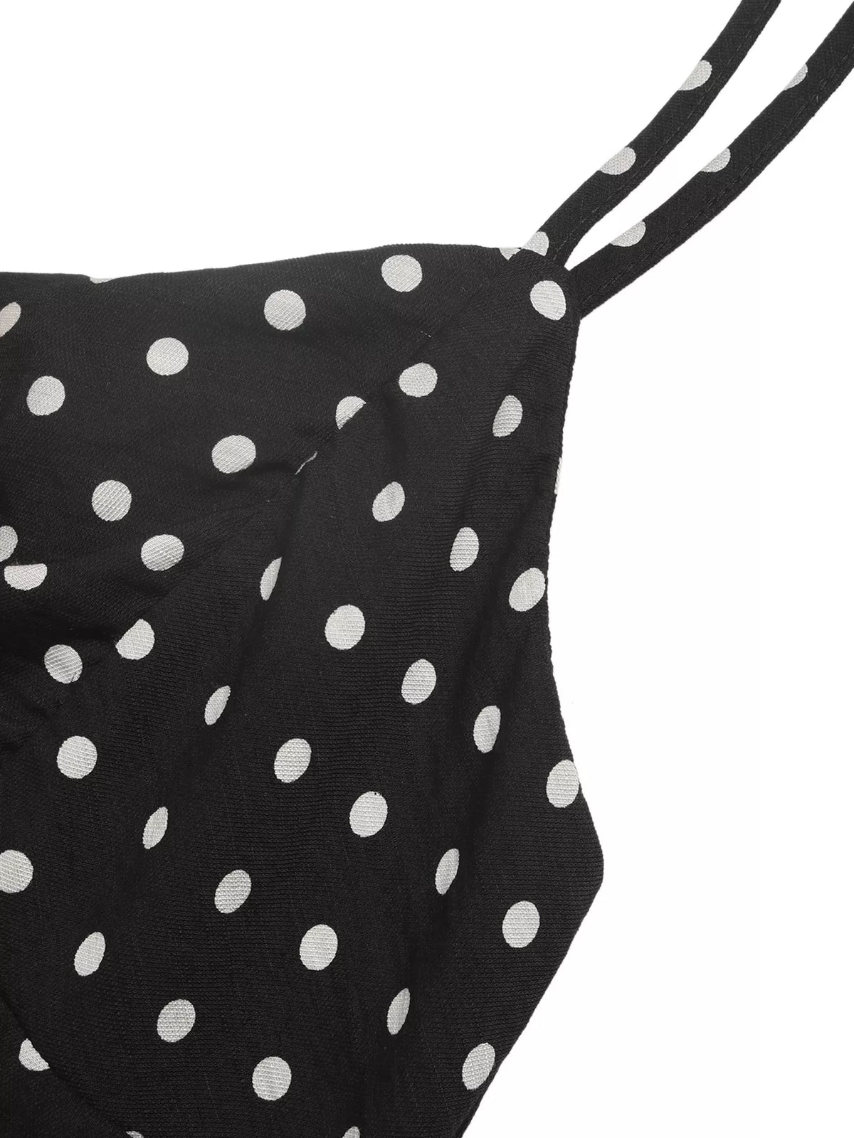 Black polka dot spaghetti strap ruffle hem dress front view