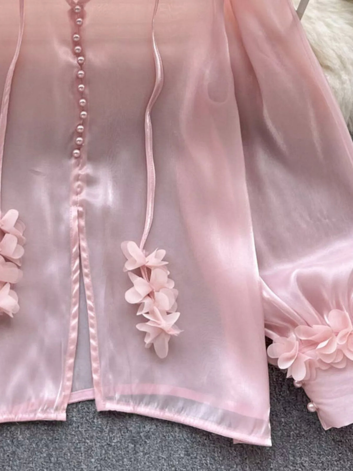Bow detail on the sheer floral button front shirt