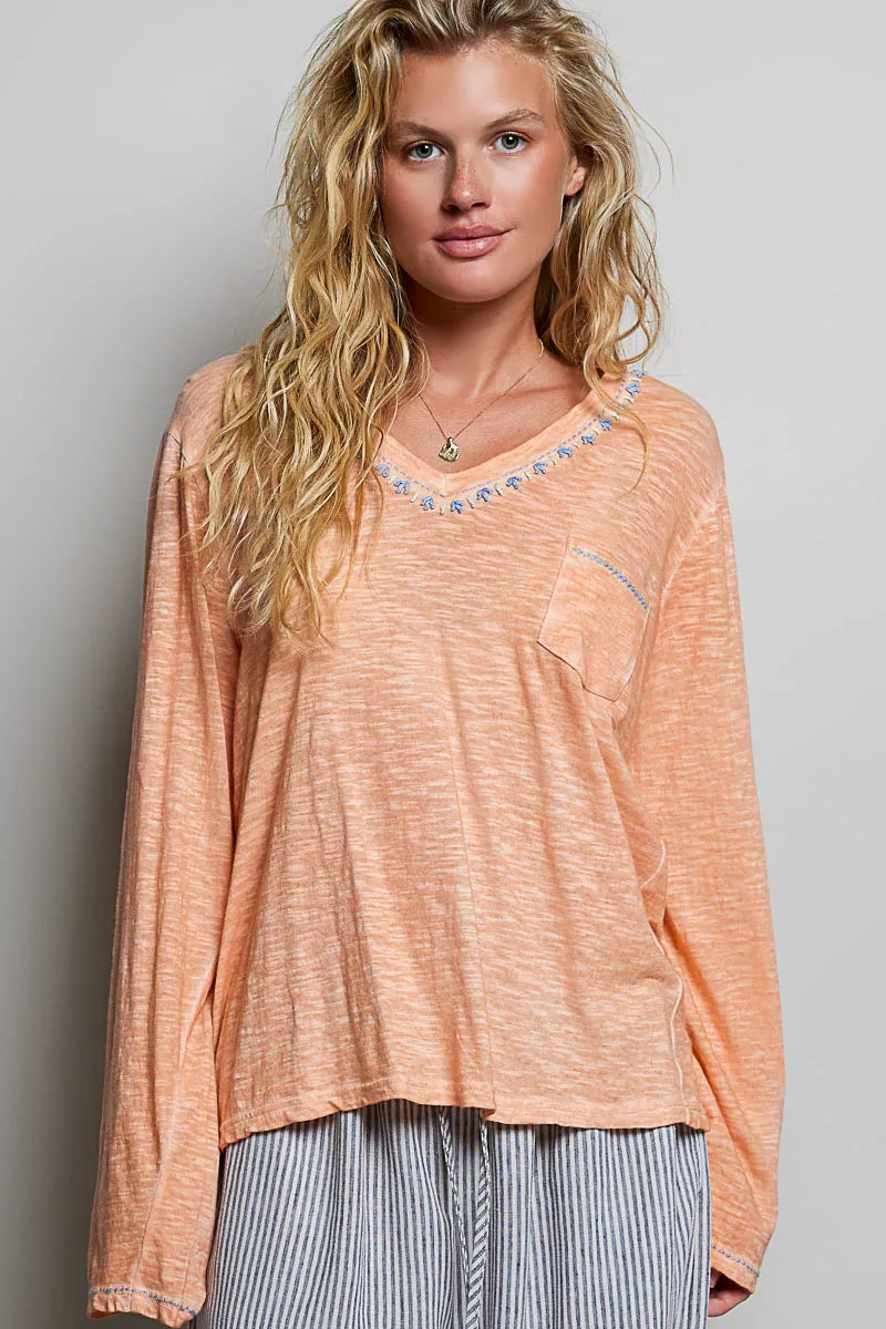 Coral peach contrast stitch v neck long sleeve knit top detail view