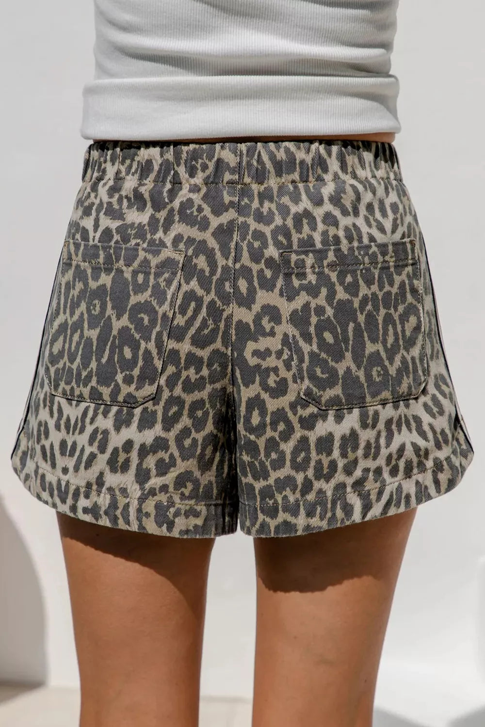 Leopard print shorts shown from the back with pockets