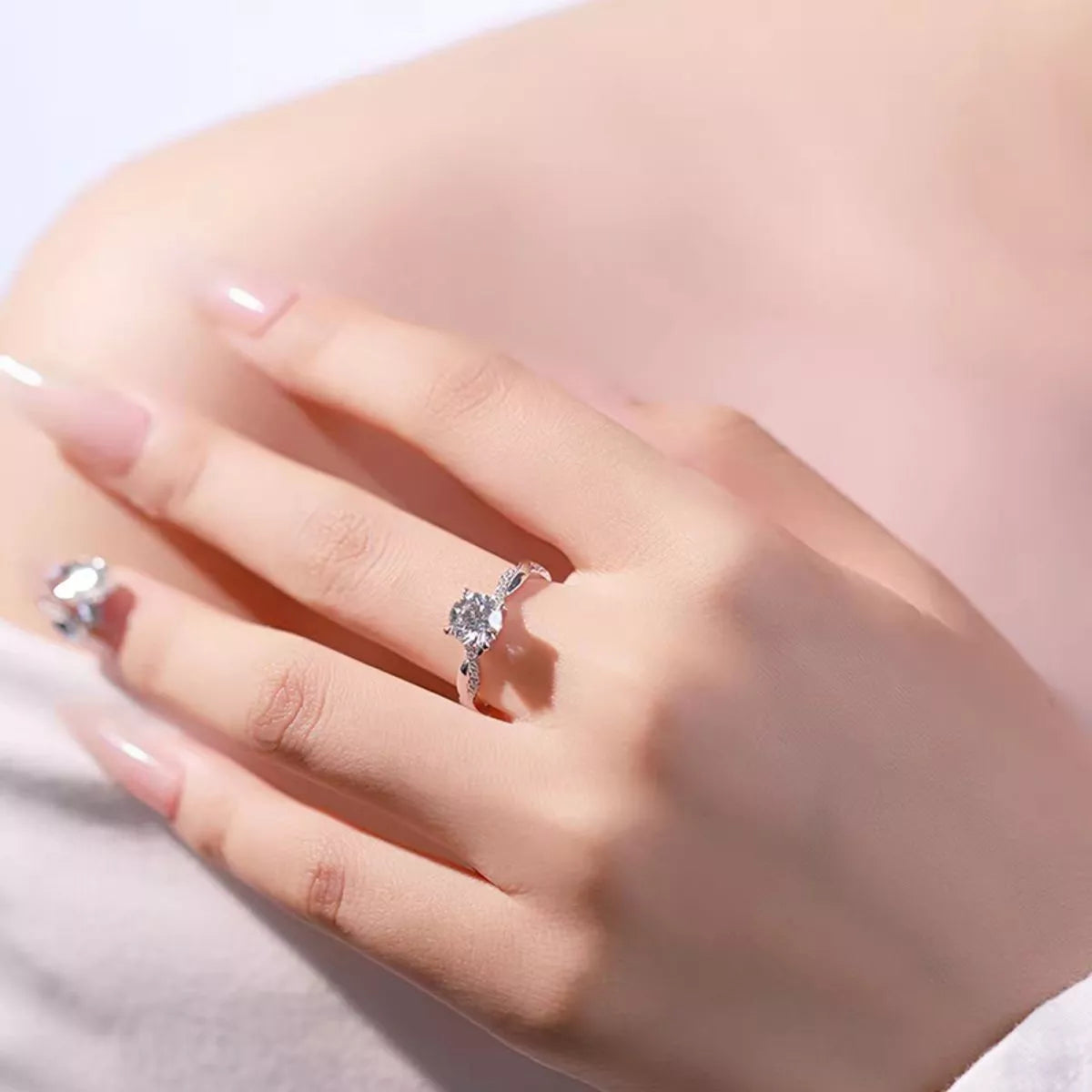 1 carat moissanite ring with a twisted sterling silver band