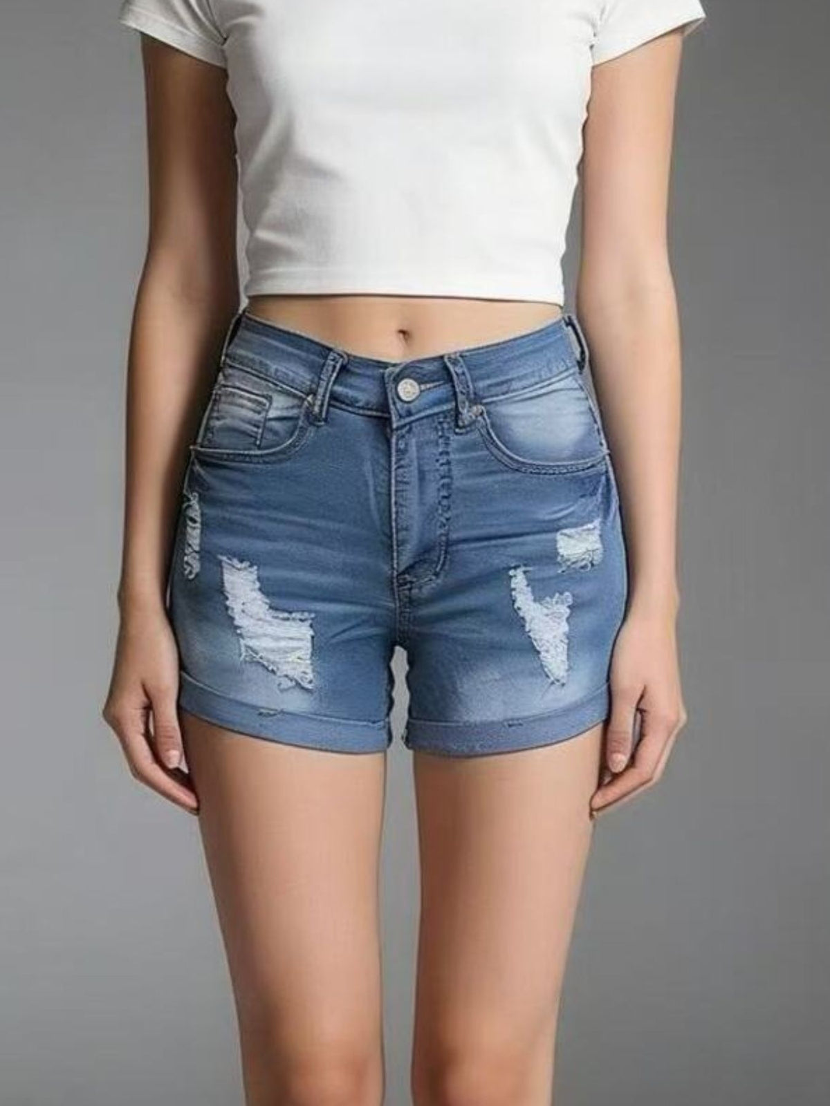 Hem detail on distressed denim shorts