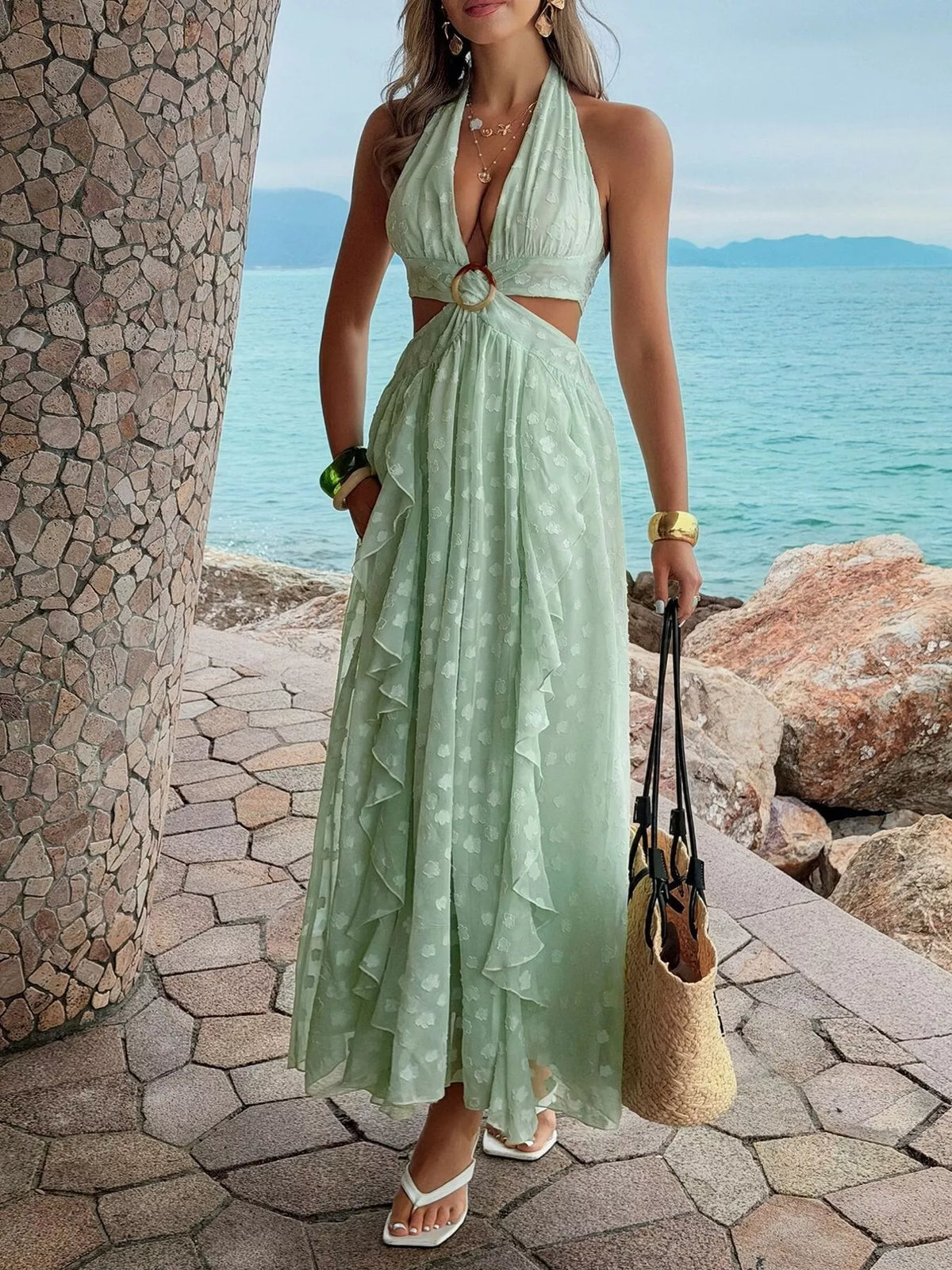 Green ruffled halter neck maxi dress three quarter view