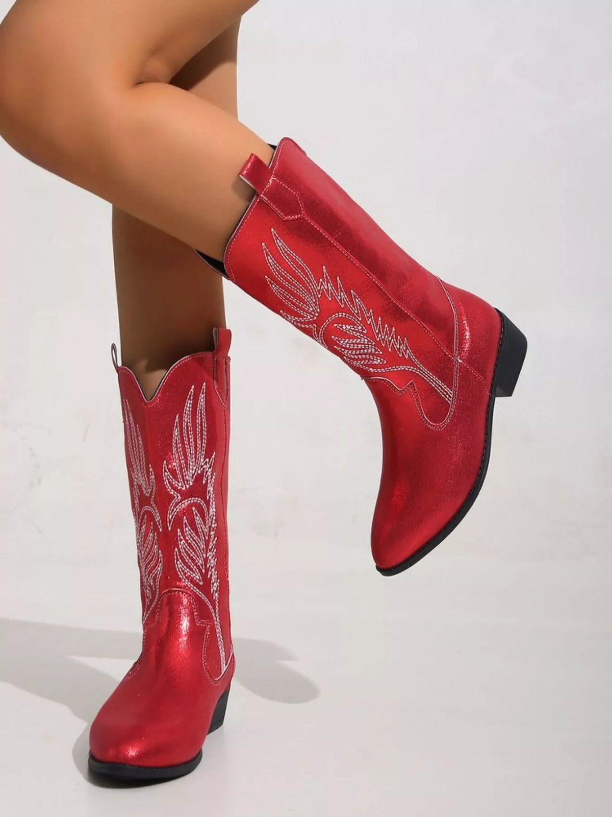 embroidered block heel boots pair standing