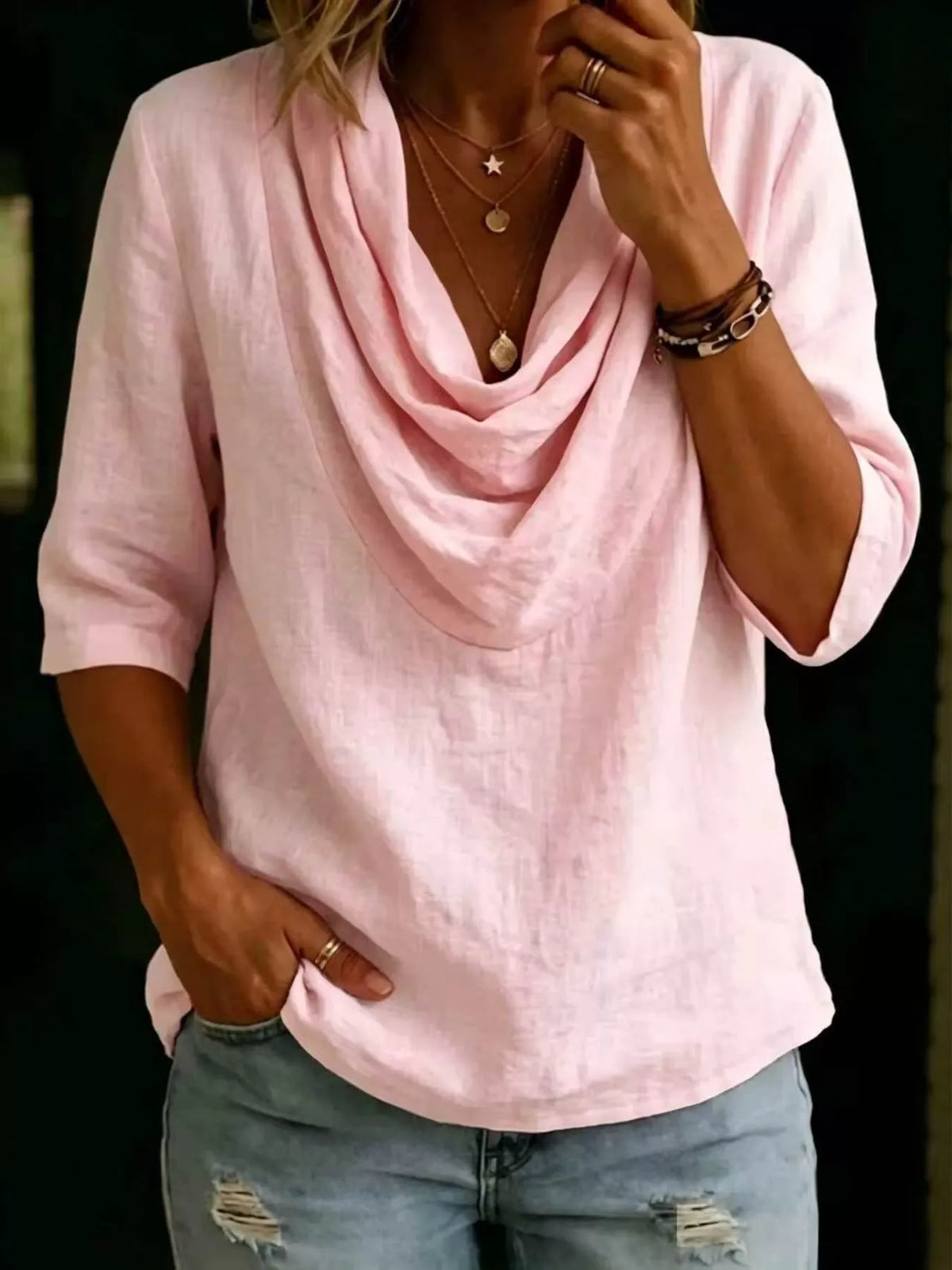 Close up of fabric drape on cowl neckline
