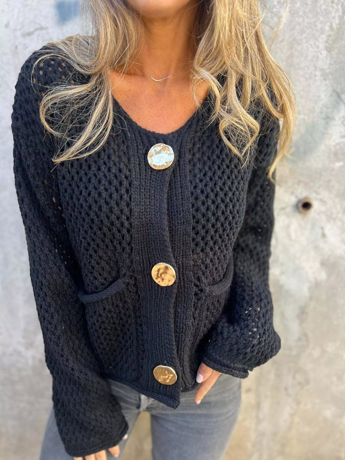 crochet button up cardigan worn with denim