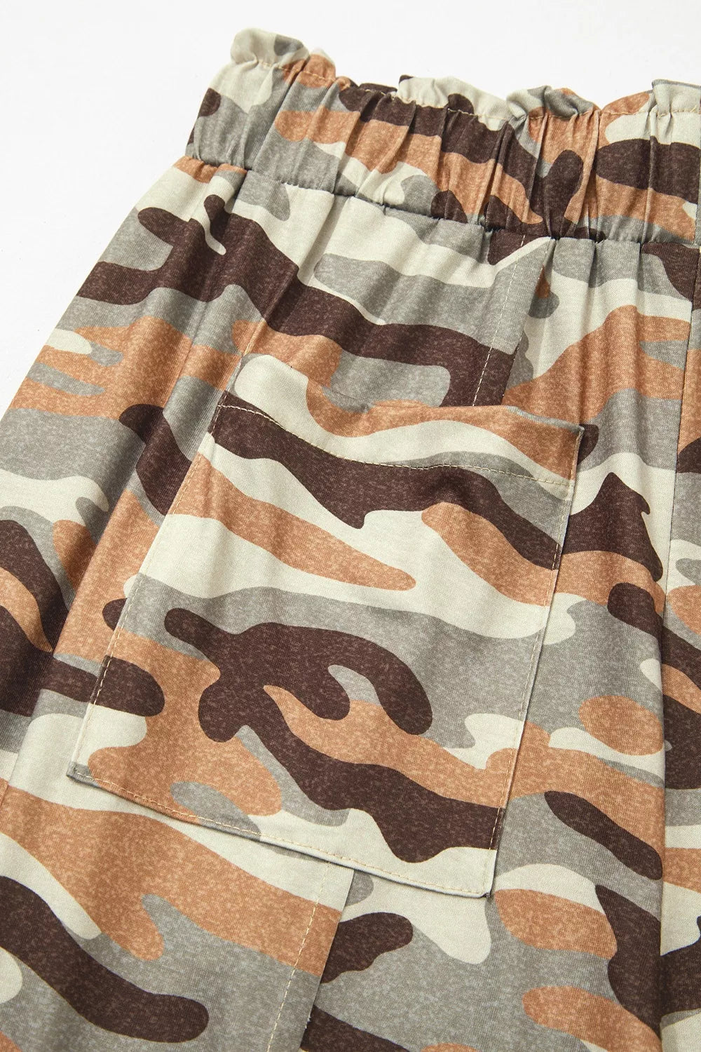 Camouflage joggers seated showing stretch and comfort