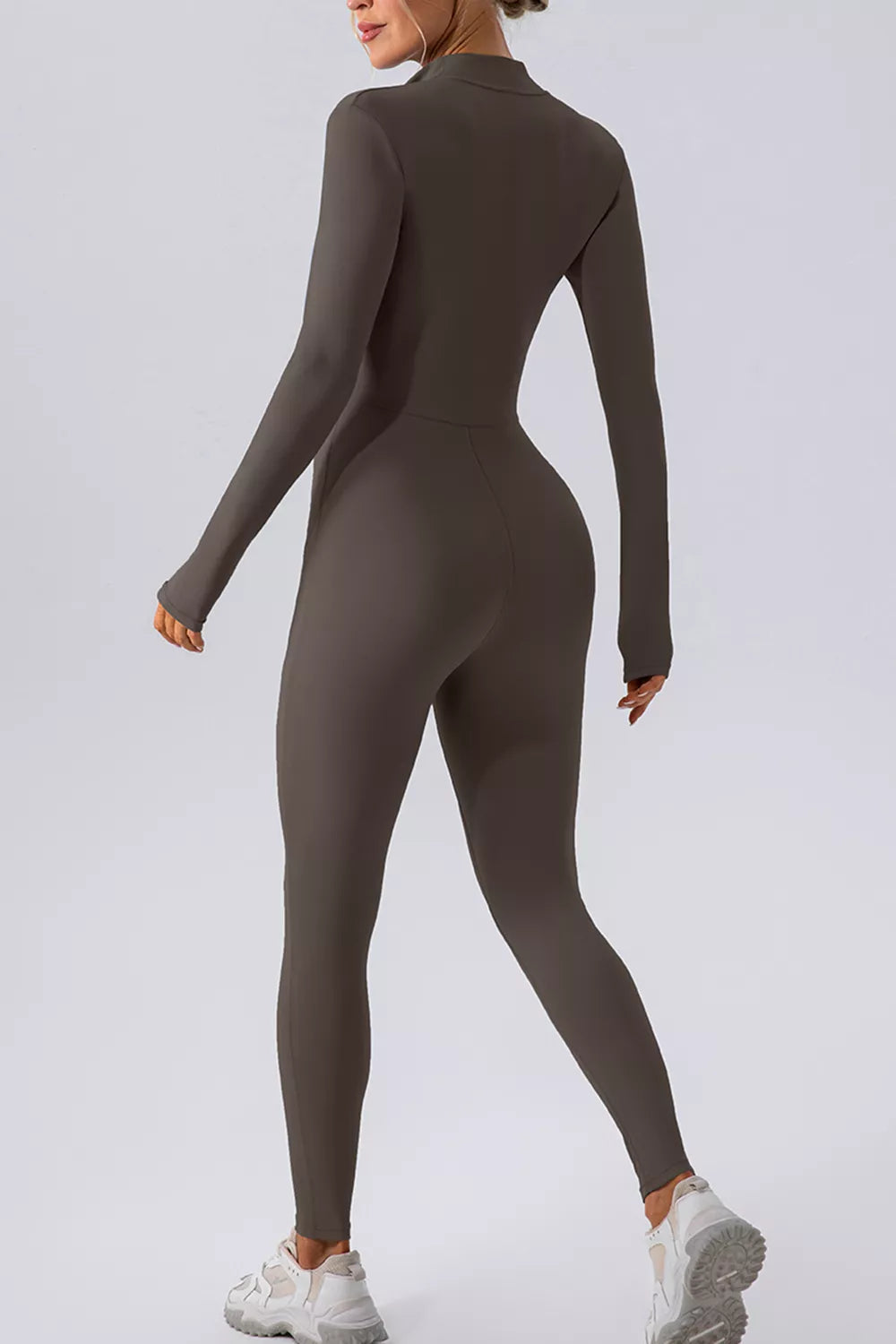 Half zip mock neck active jumpsuit neckline detail