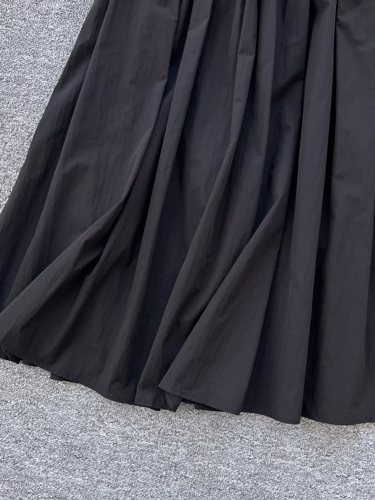 Close view of the high waistband on the skirt