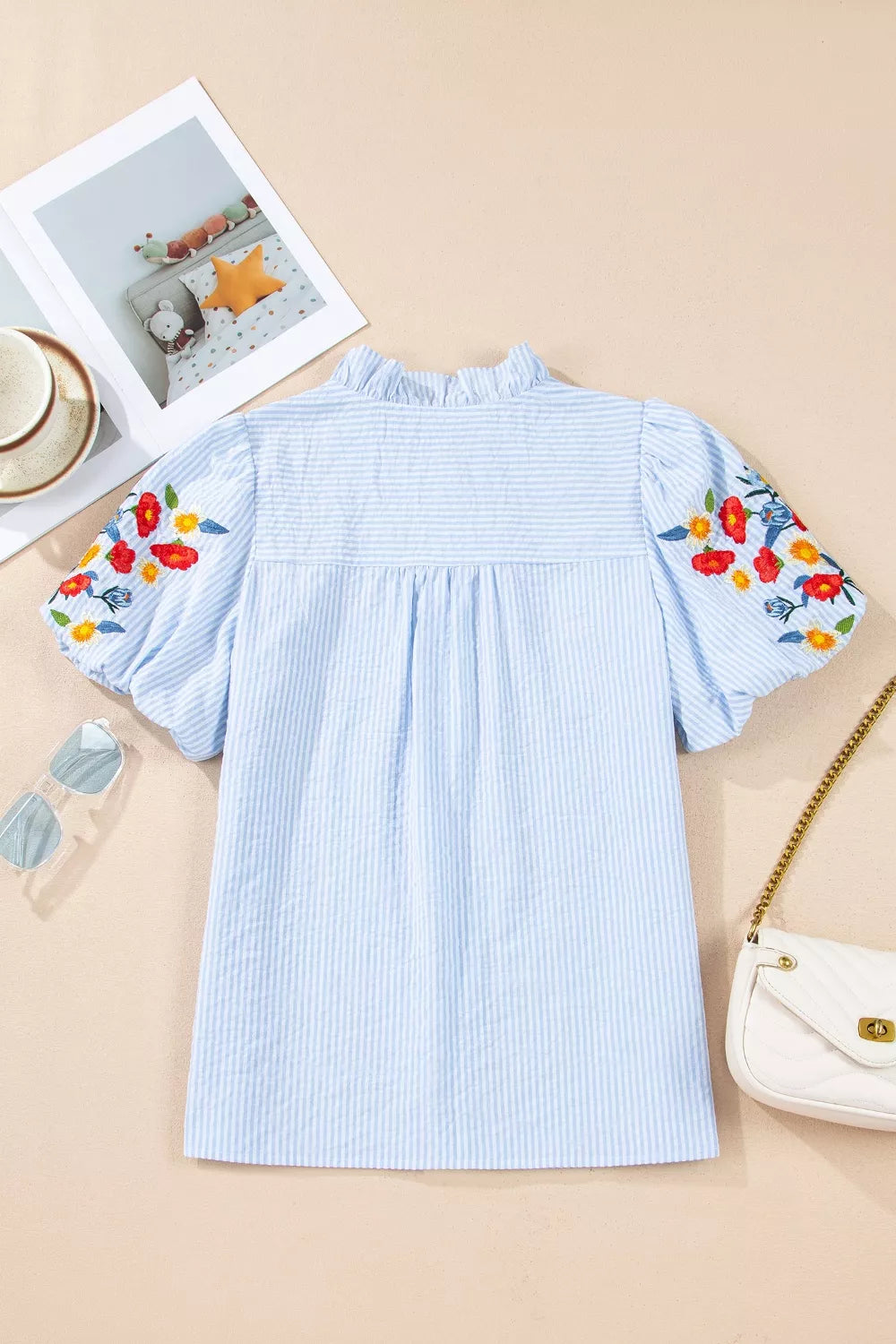 Light blue striped floral embroidered puff sleeve shirt front view