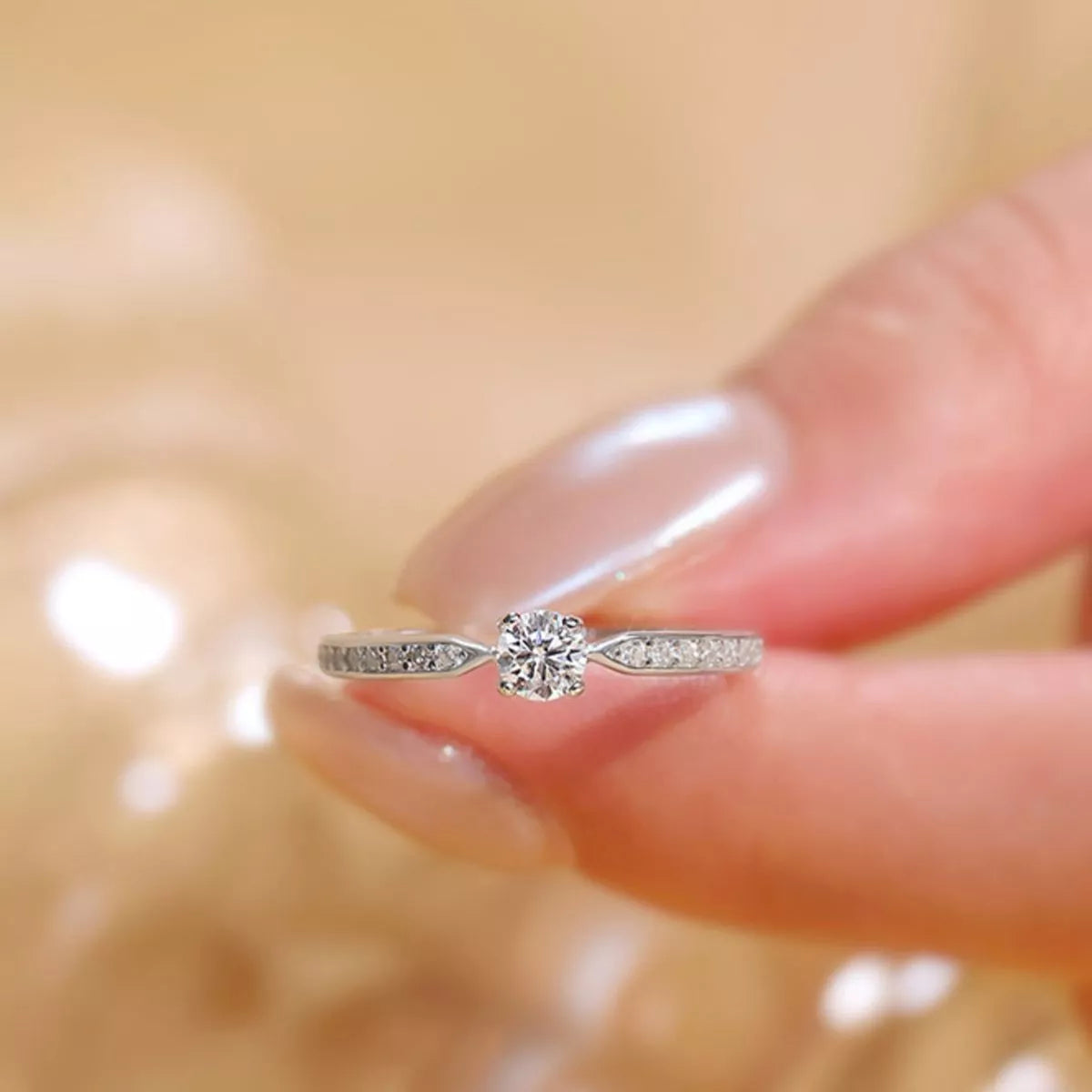 Moissanite ring shown catching direct light