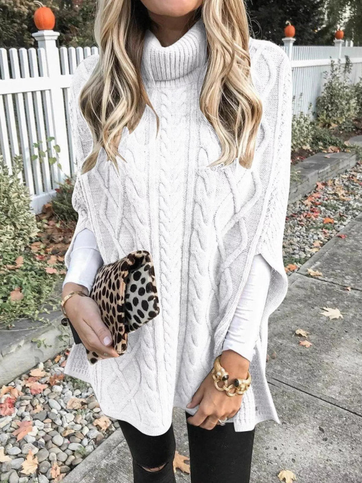 Chunky cable knit turtleneck poncho back view