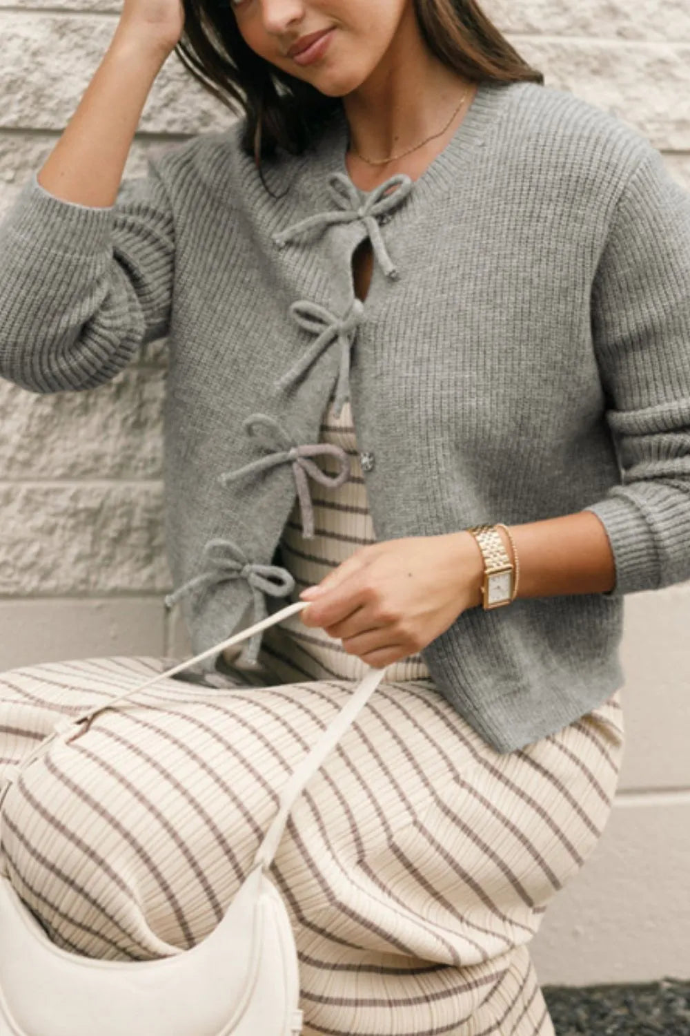 Round neck cardigan bow detail close up