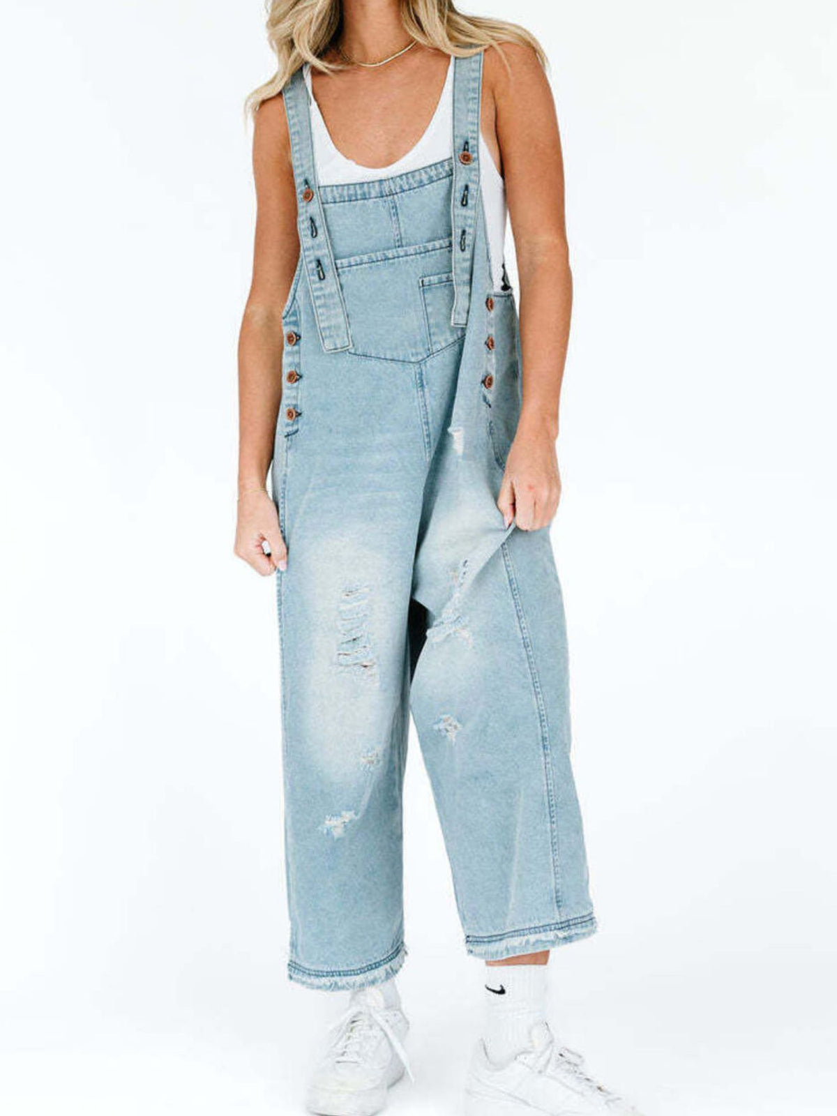 Distressed overalls strap detail