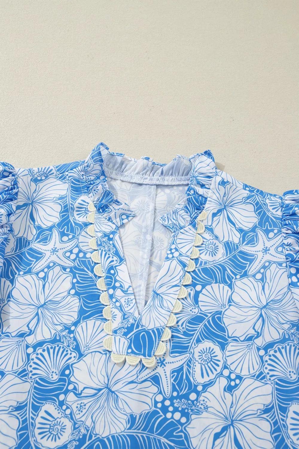 Light blue floral scalloped trim v neck blouse styled view