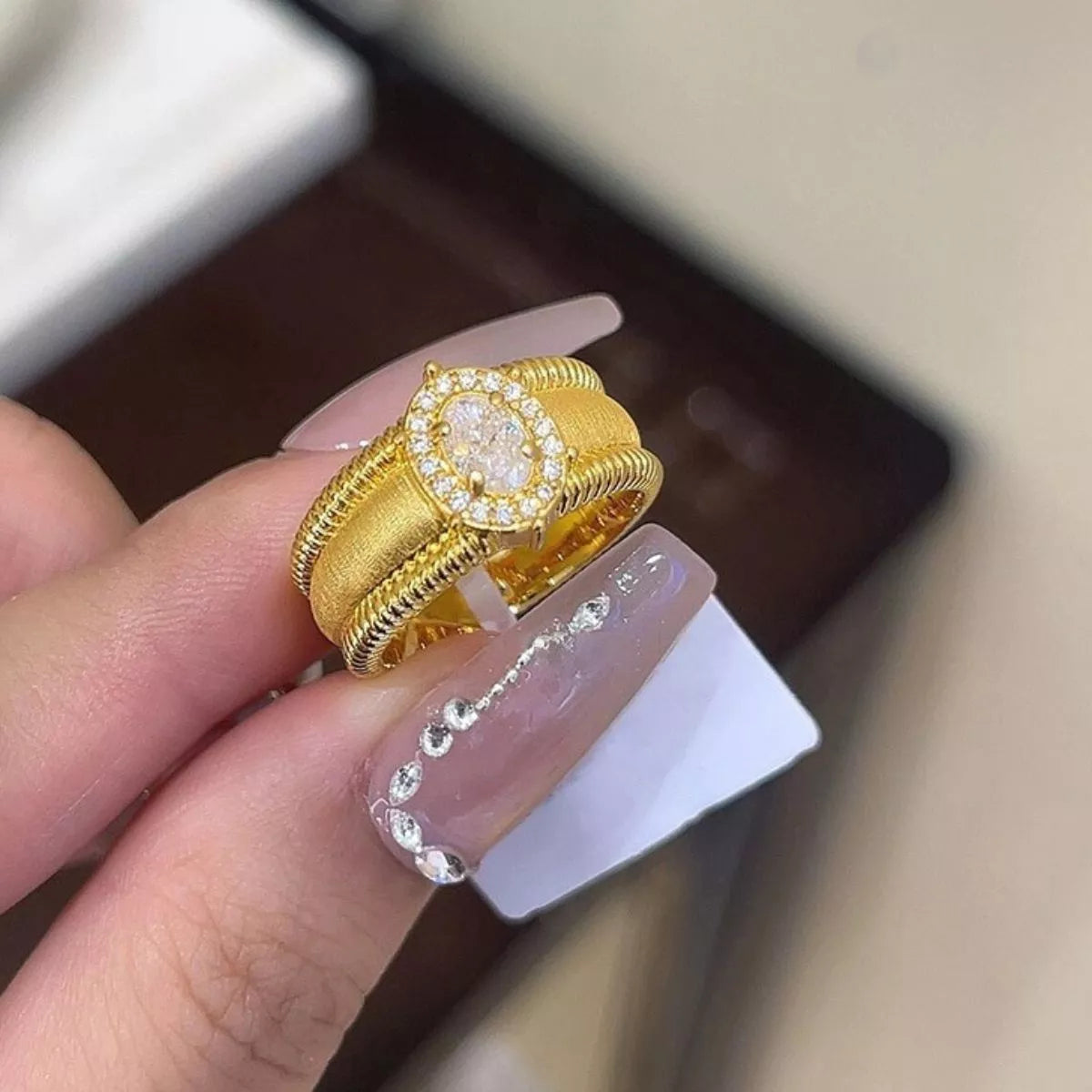 Close up of zircon stone on gold plated ring
